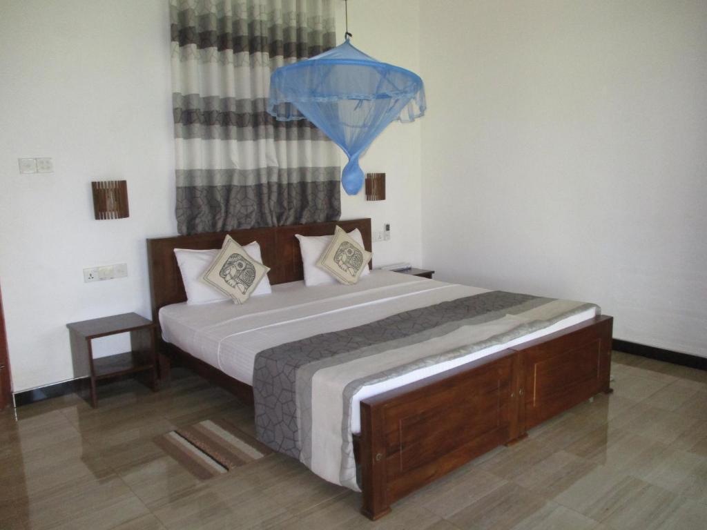 Postel nebo postele na pokoji v ubytování Peacock Lake Villa