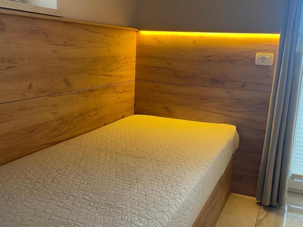 Postel nebo postele na pokoji v ubytování Rooms and Apartments Lisjak