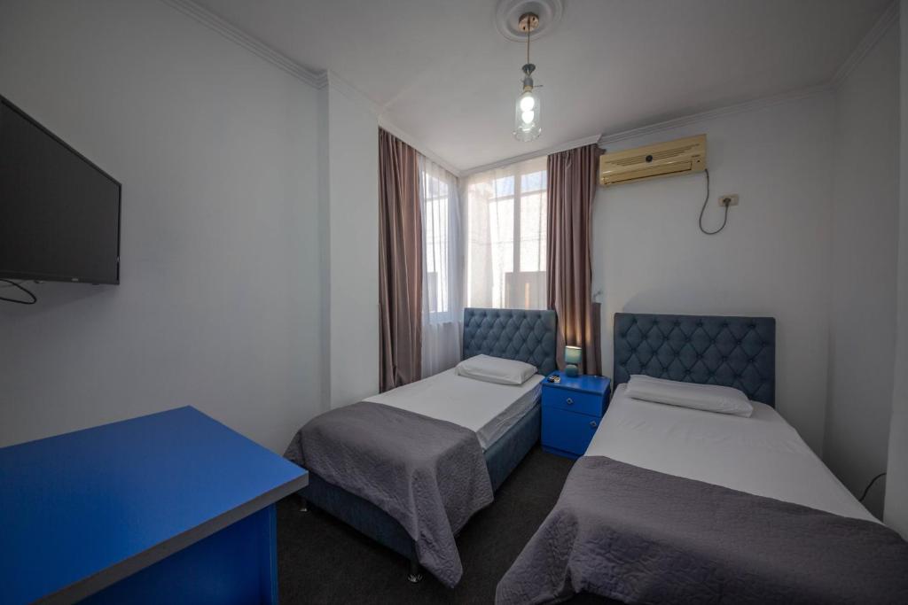 Postel nebo postele na pokoji v ubytování Hotel 3A