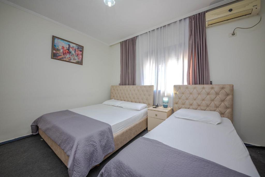 Postel nebo postele na pokoji v ubytování Hotel 3A