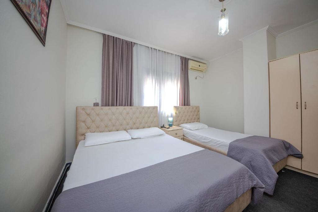 Postel nebo postele na pokoji v ubytování Hotel 3A