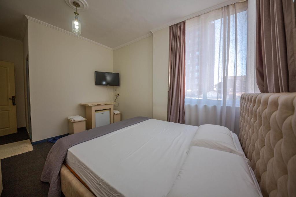 Postel nebo postele na pokoji v ubytování Hotel 3A