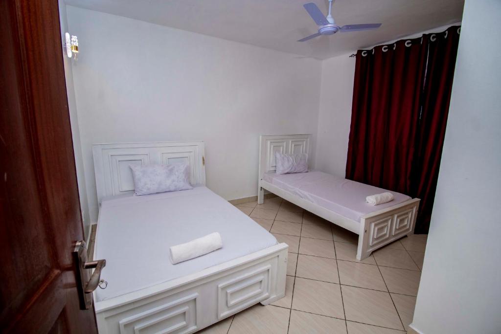 Ένα ή περισσότερα κρεβάτια σε δωμάτιο στο Jovey homes