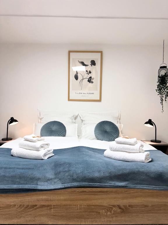 a bedroom with a bed with towels on it at Big Modern Space 75sqm in Herborn