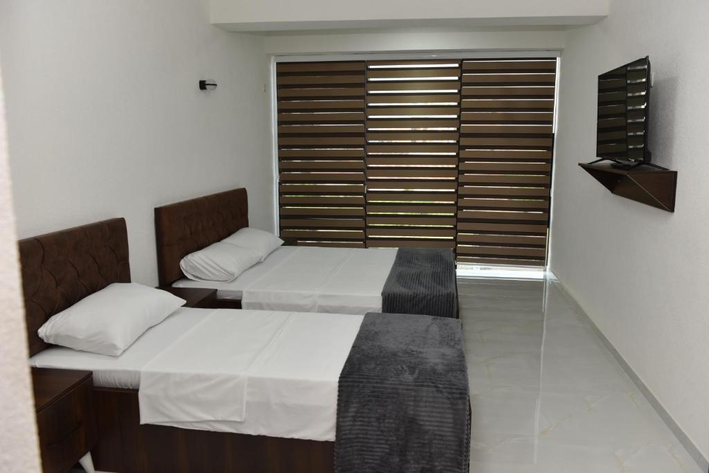 Postel nebo postele na pokoji v ubytování Hostel Jusaj Glob