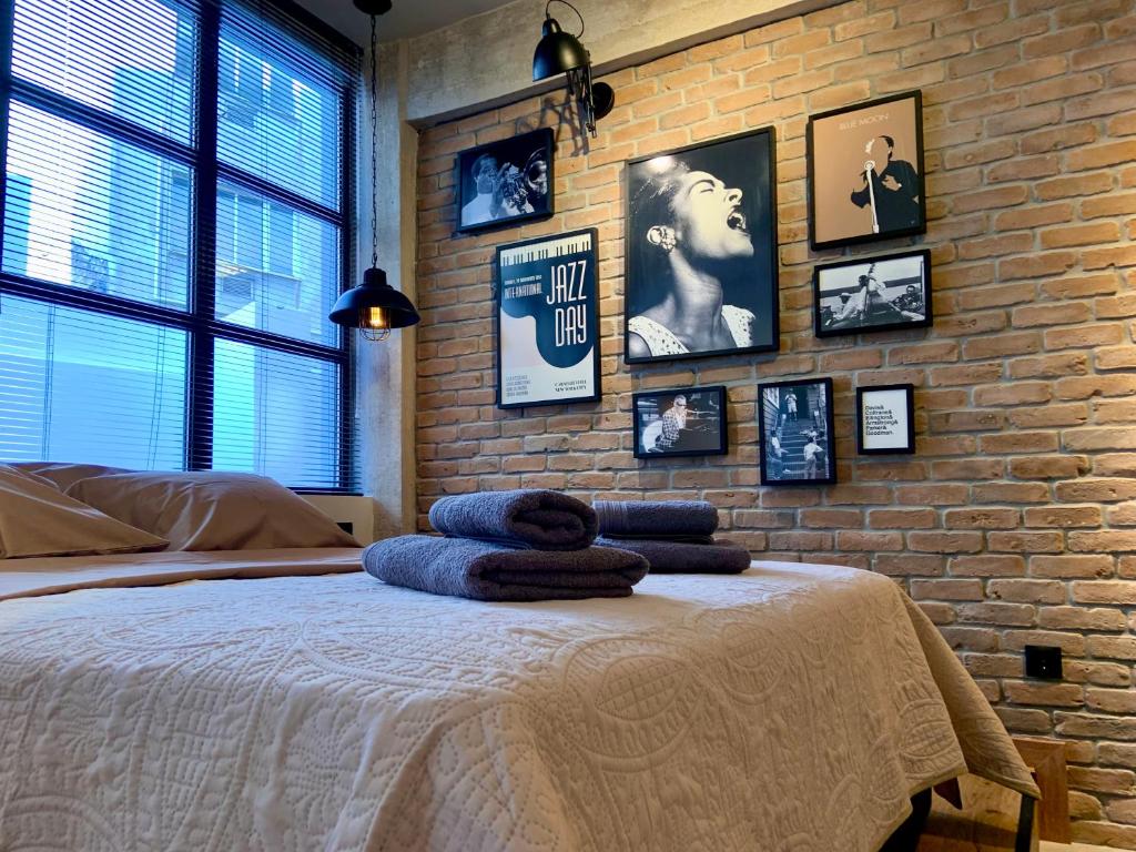 Ένα ή περισσότερα κρεβάτια σε δωμάτιο στο City Plus by CityBee