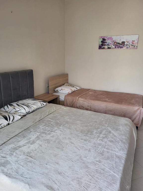 Postel nebo postele na pokoji v ubytování Aron Home