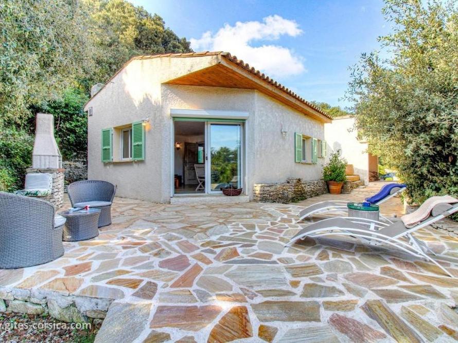 a stone patio in front of a house at Gîte Acellu in Bonifacio