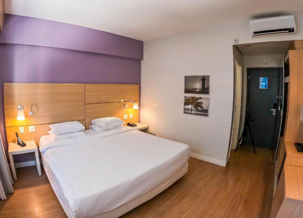 Postel nebo postele na pokoji v ubytování Stay Inn Santos Sua acomodação com cara de Hotel