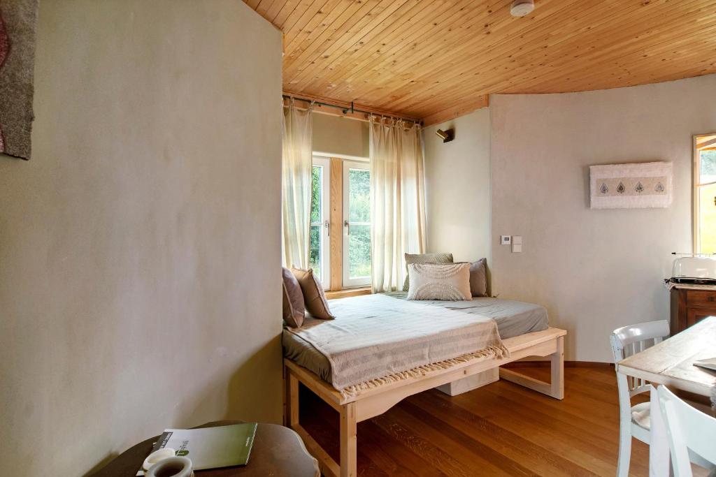 Postel nebo postele na pokoji v ubytování Uptrulli-Minihaus