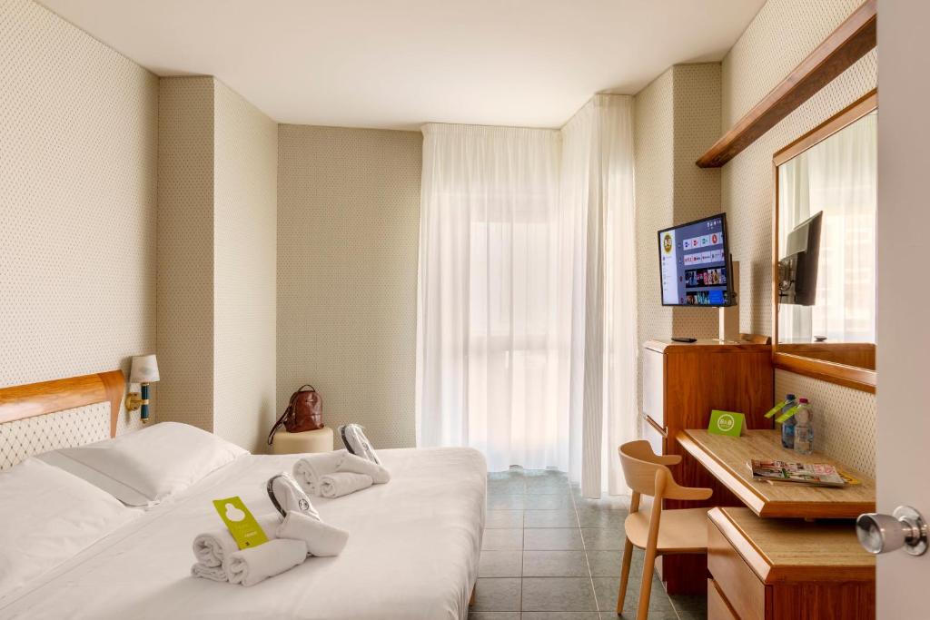 Postel nebo postele na pokoji v ubytování B&B Hotel Chioggia Airone