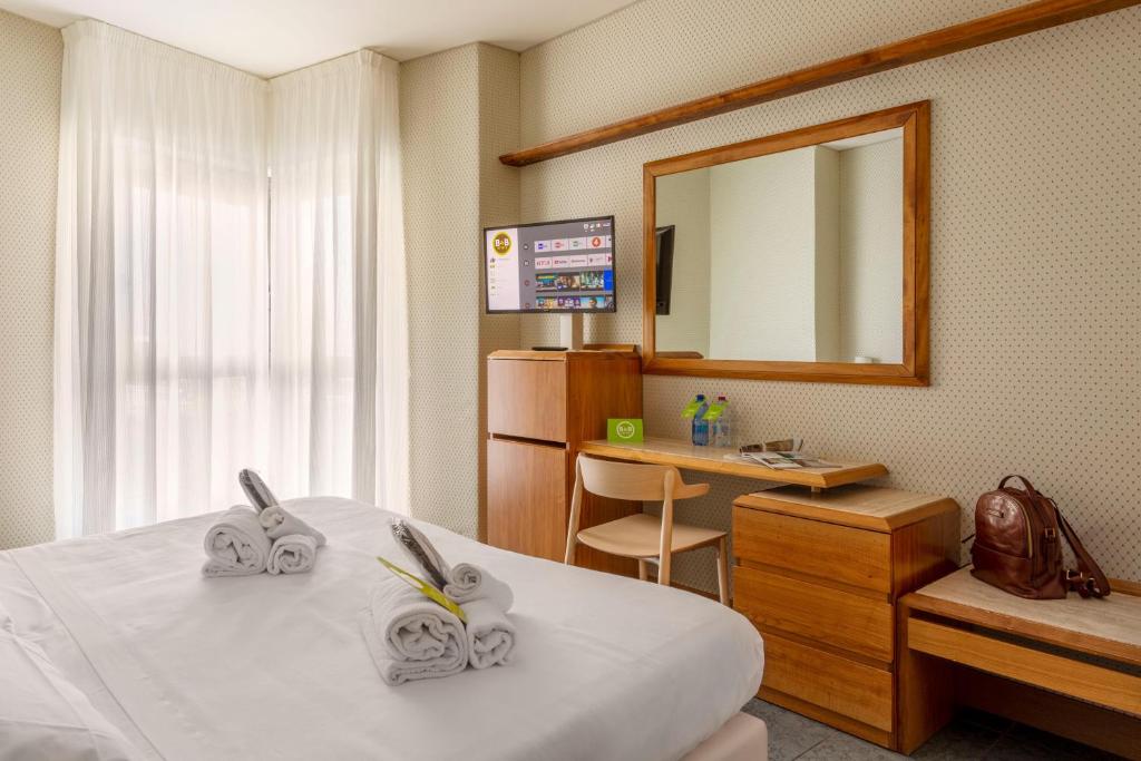 TV a/nebo společenská místnost v ubytování B&B Hotel Chioggia Airone