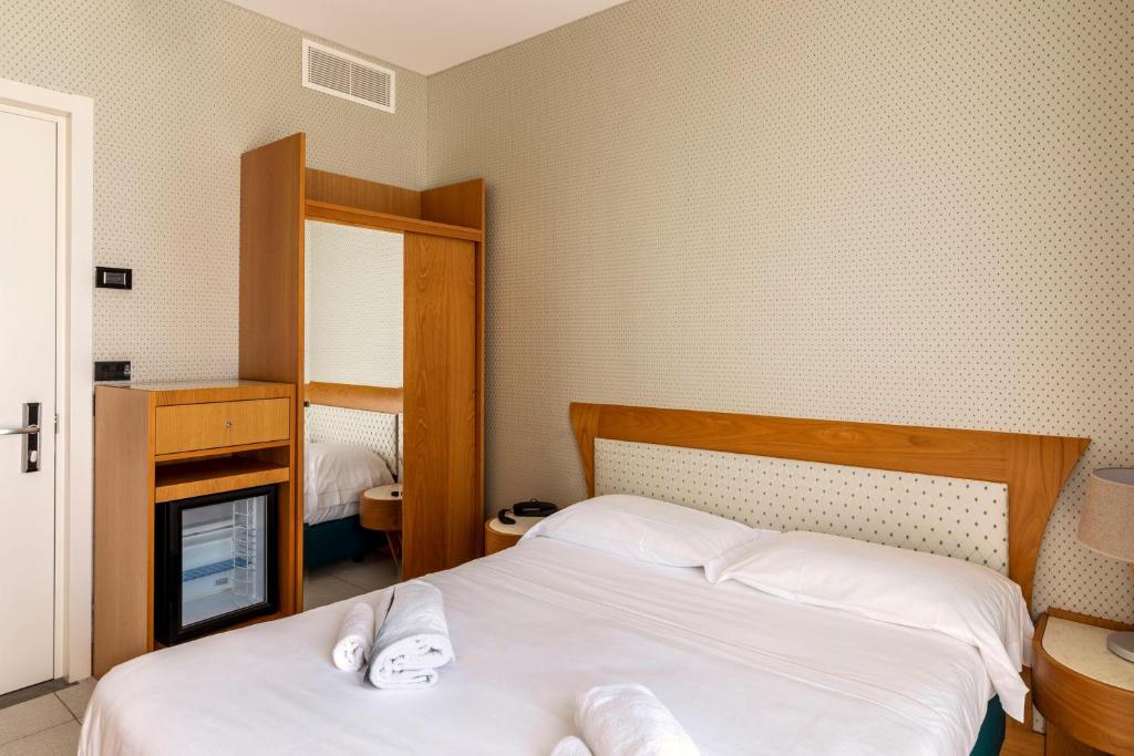 Postel nebo postele na pokoji v ubytování B&B Hotel Chioggia Airone
