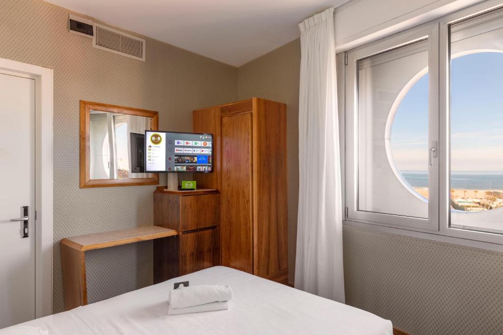 TV a/nebo společenská místnost v ubytování B&B Hotel Chioggia Airone