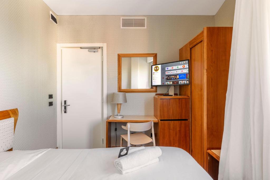 Postel nebo postele na pokoji v ubytování B&B Hotel Chioggia Airone