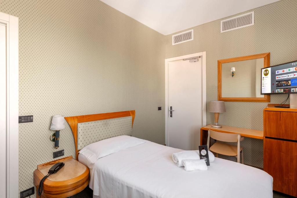 Postel nebo postele na pokoji v ubytování B&B Hotel Chioggia Airone
