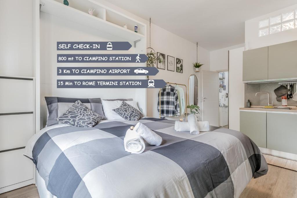 a bedroom with a large bed in a kitchen at Flyaway Retreat - Ciampino Apartment 15 min To Rome in Ciampino