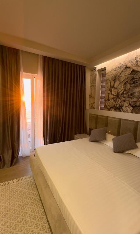 Postel nebo postele na pokoji v ubytování Hotel Kristera