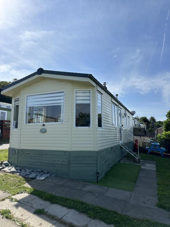 a white house with a window on the side of it at MoonStone in Aberystwyth