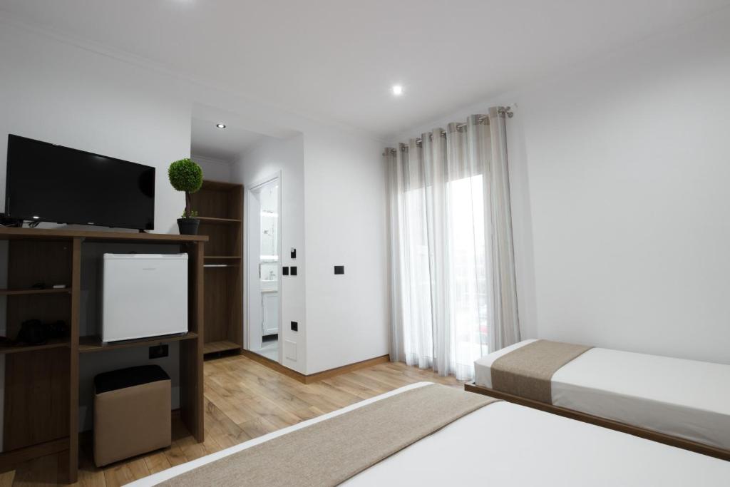 Postel nebo postele na pokoji v ubytování Bliss Hotel