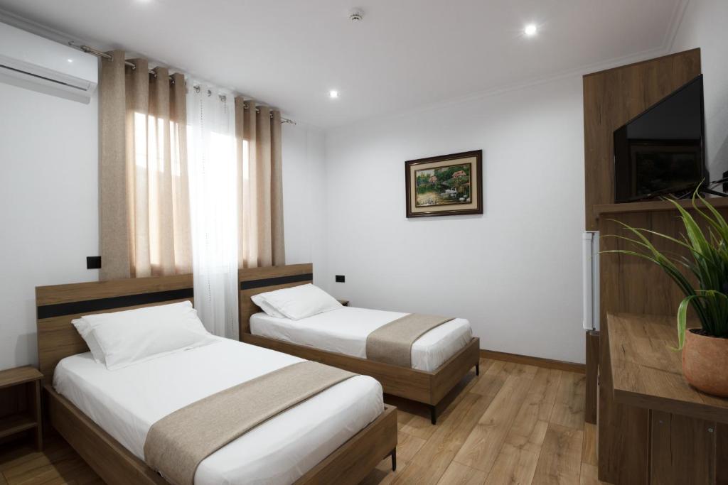 Postel nebo postele na pokoji v ubytování Bliss Hotel