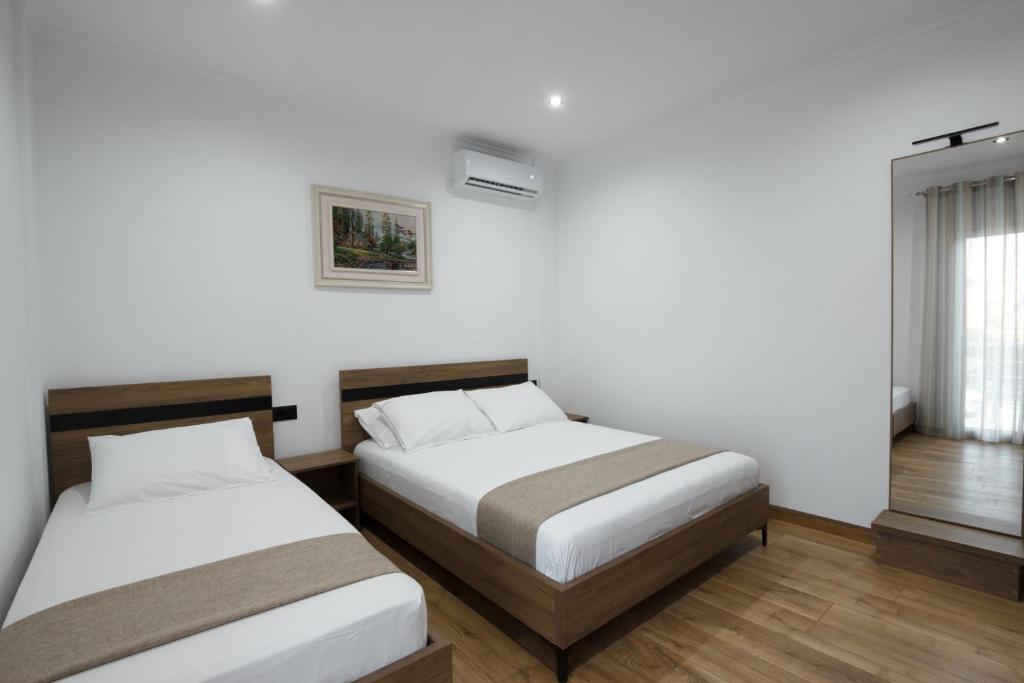 Postel nebo postele na pokoji v ubytování Bliss Hotel
