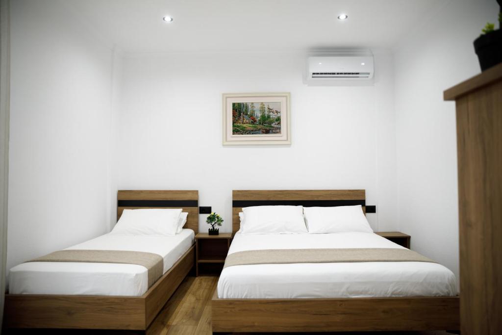 Postel nebo postele na pokoji v ubytování Bliss Hotel