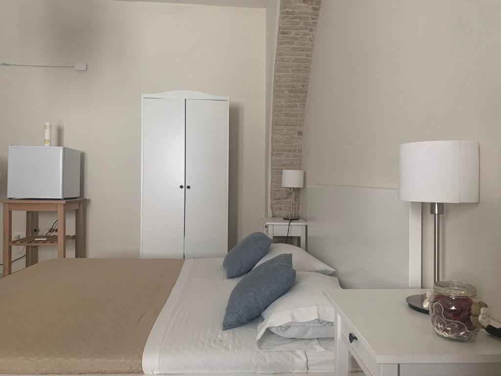 A bed or beds in a room at Affittacamere La Torre