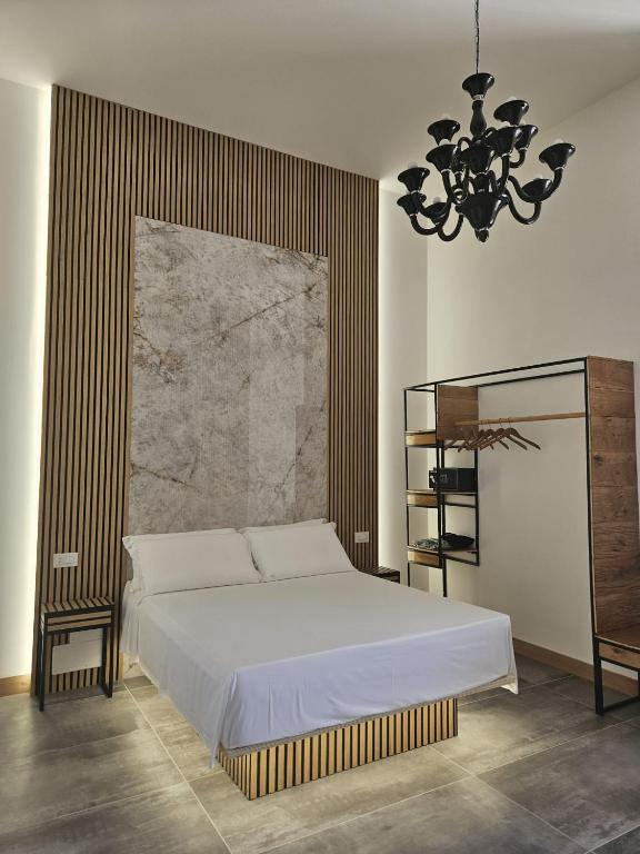 Postel nebo postele na pokoji v ubytování DADA Suites and Sea