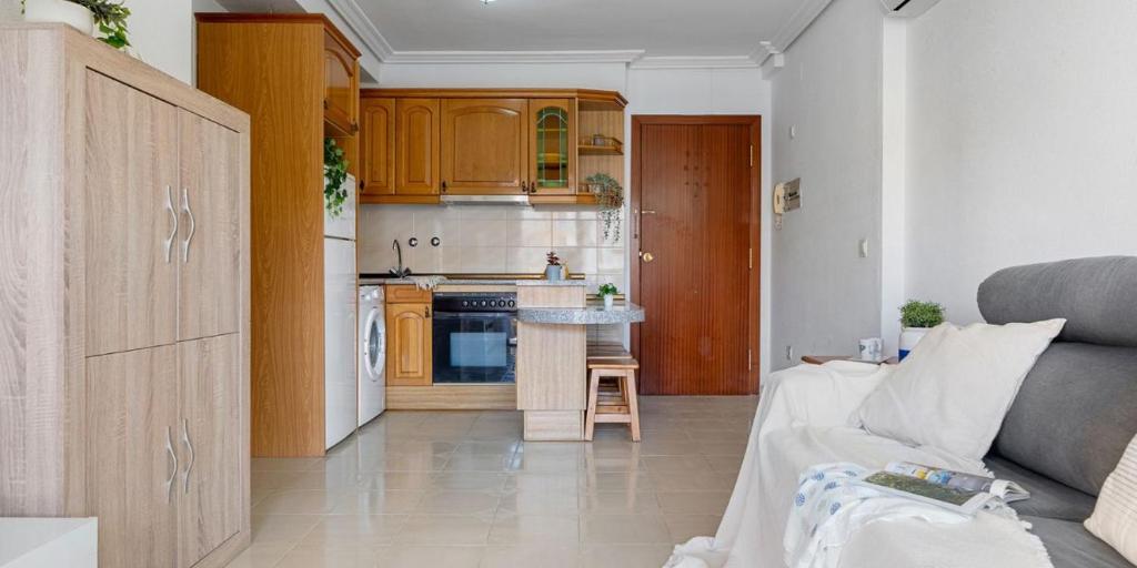 A kitchen or kitchenette at Albeniz Apartments