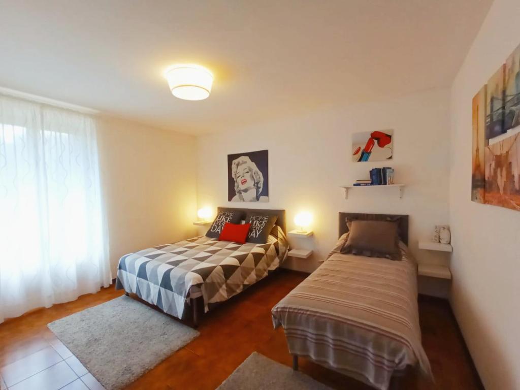 Posteľ alebo postele v izbe v ubytovaní Casa Dante