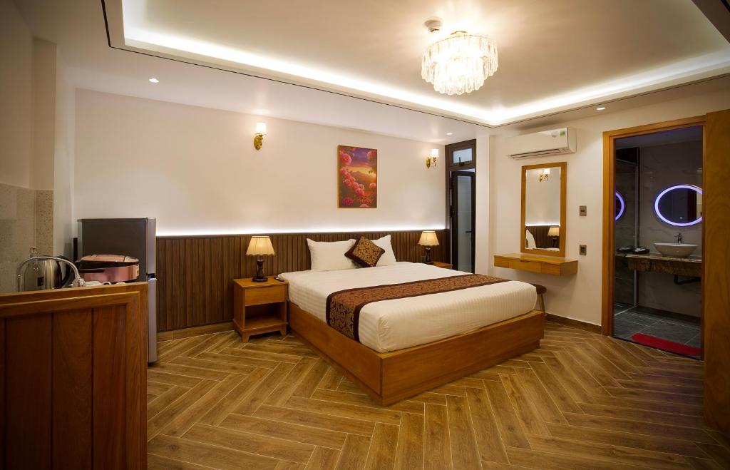 Giường trong phòng chung tại La Fleur Premium Central Apartment Hotel