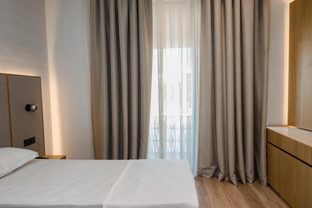 Postel nebo postele na pokoji v ubytování Riviera Blu- Seaside Hotel