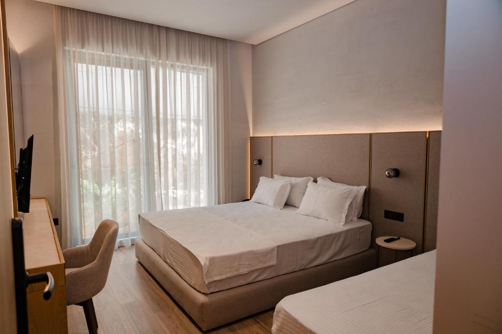 Postel nebo postele na pokoji v ubytování Riviera Blu- Seaside Hotel