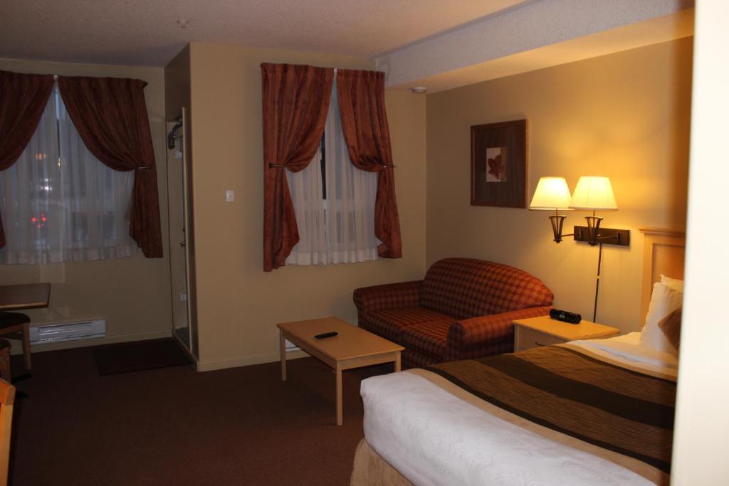 Postel nebo postele na pokoji v ubytování Clearwater Hotel Ltd