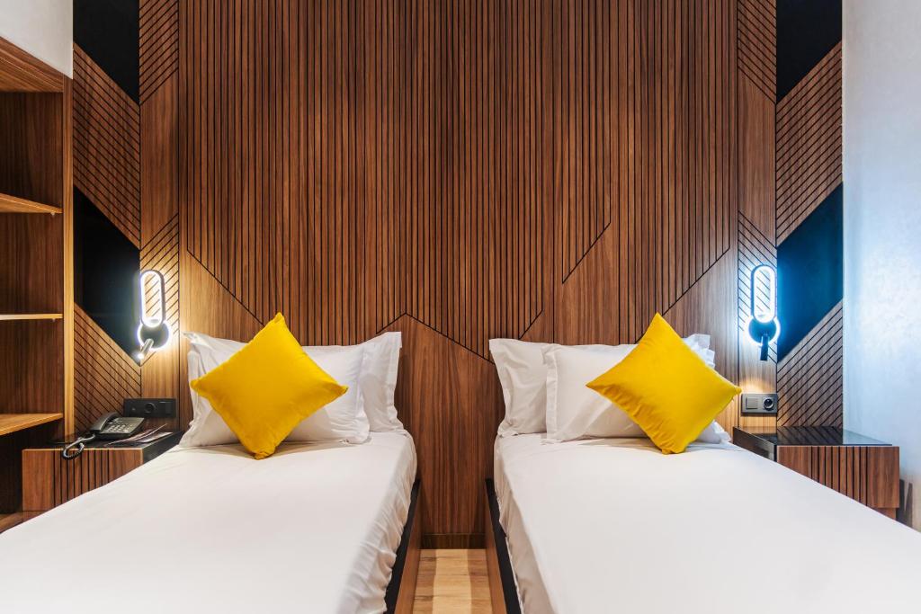 Letto o letti in una camera di Hotel Charf