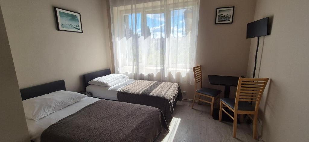 Postel nebo postele na pokoji v ubytování Sejf House