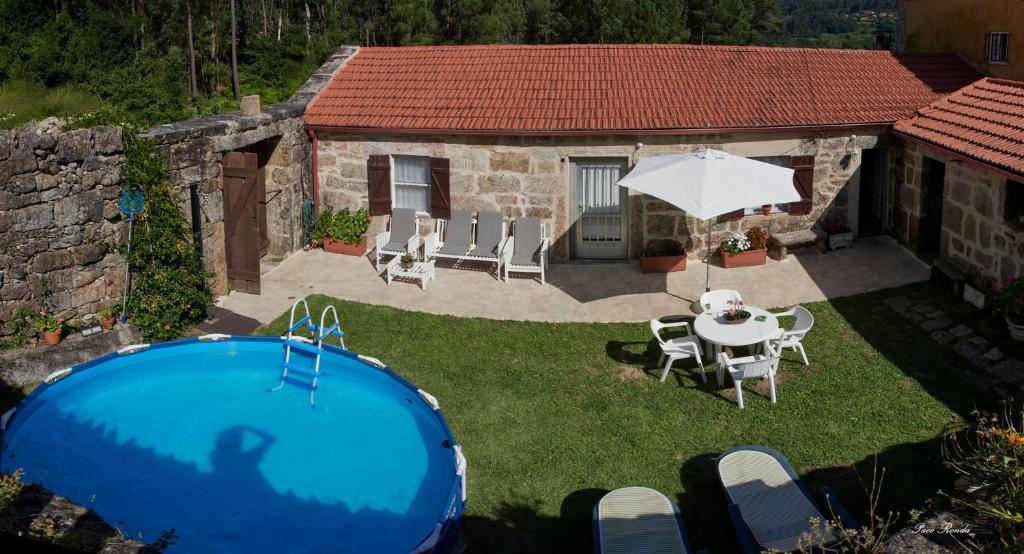 Bazén v ubytování Casa de Mila en Creciente Pontevedra nebo v jeho okolí