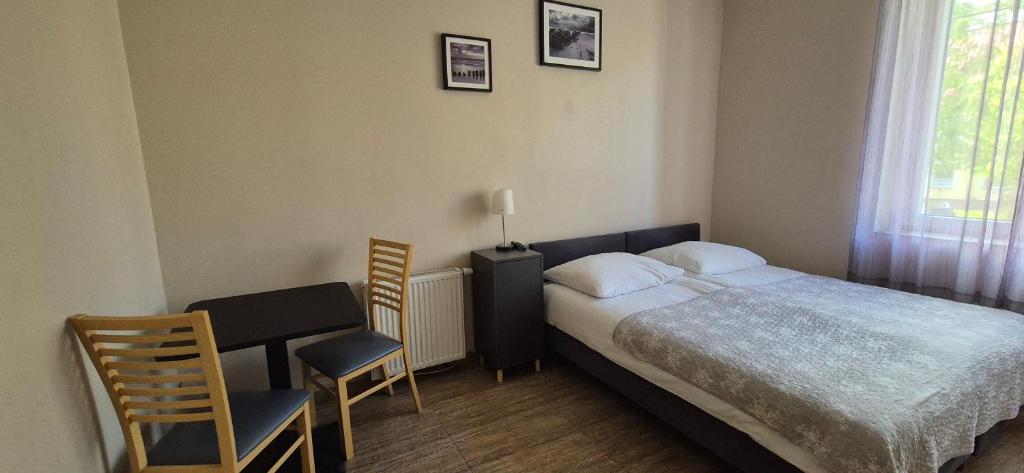 Postel nebo postele na pokoji v ubytování Sejf House
