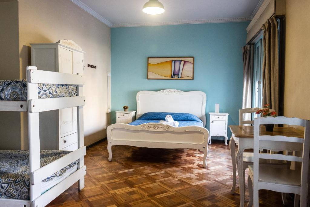 Postel nebo postele na pokoji v ubytování Hostal Providencia