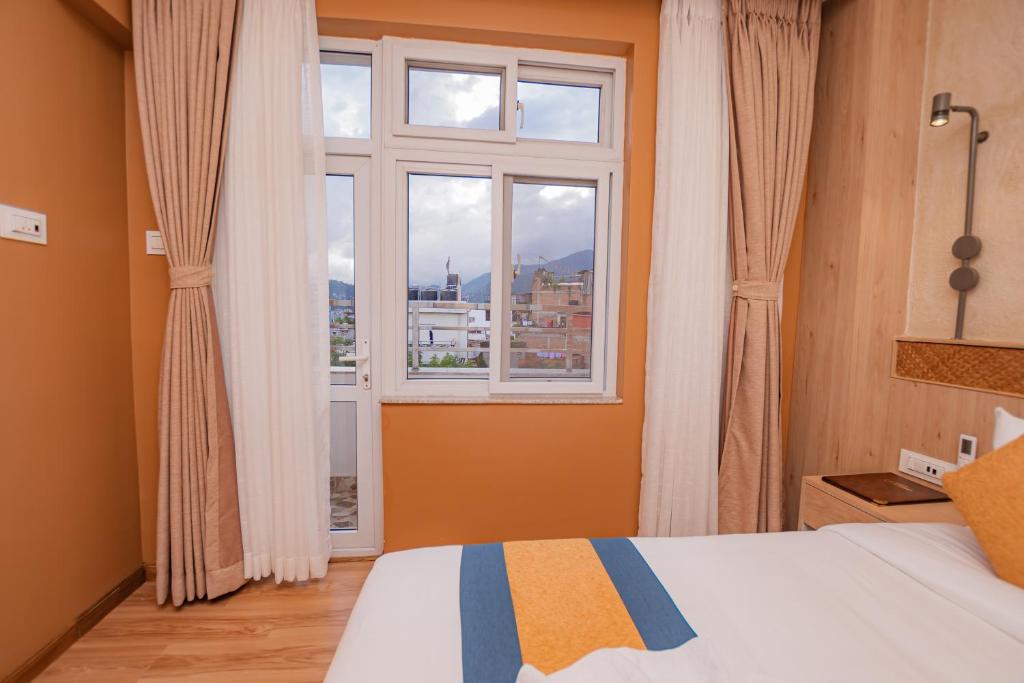 Letto o letti in una camera di Hotel Vistara