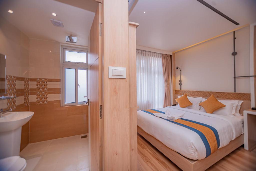 Letto o letti in una camera di Hotel Vistara