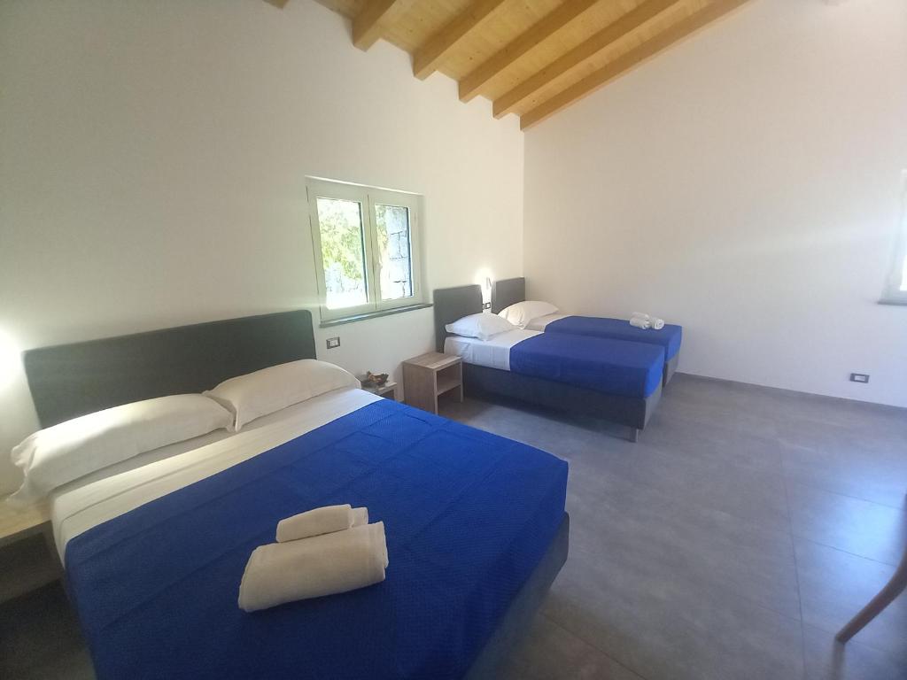 Postel nebo postele na pokoji v ubytování Agriturismo Lumia Resort