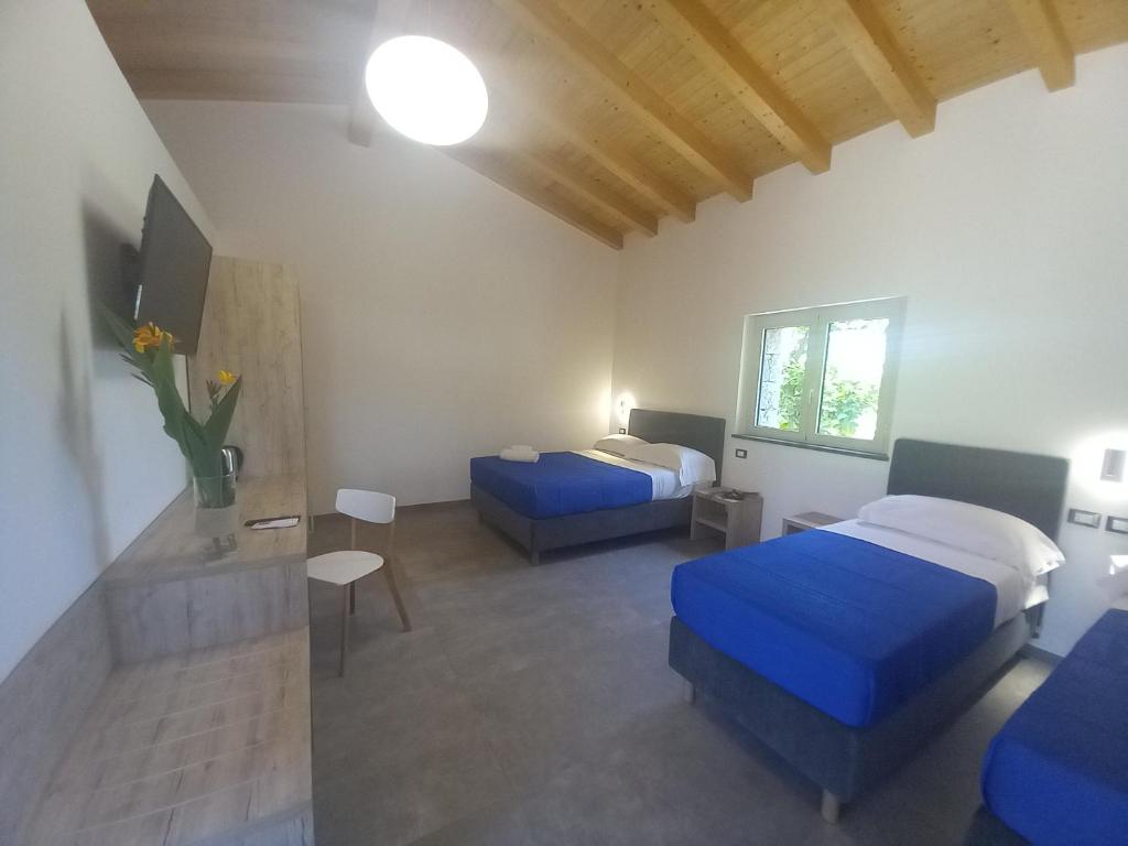 Postel nebo postele na pokoji v ubytování Agriturismo Lumia Resort