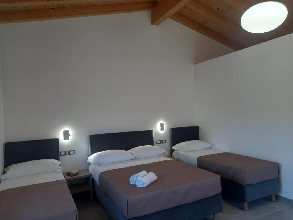 Postel nebo postele na pokoji v ubytování Agriturismo Lumia Resort