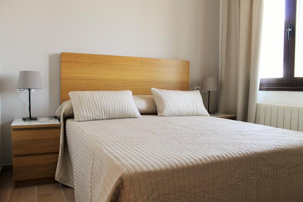 Postel nebo postele na pokoji v ubytování Hostal Landhaus