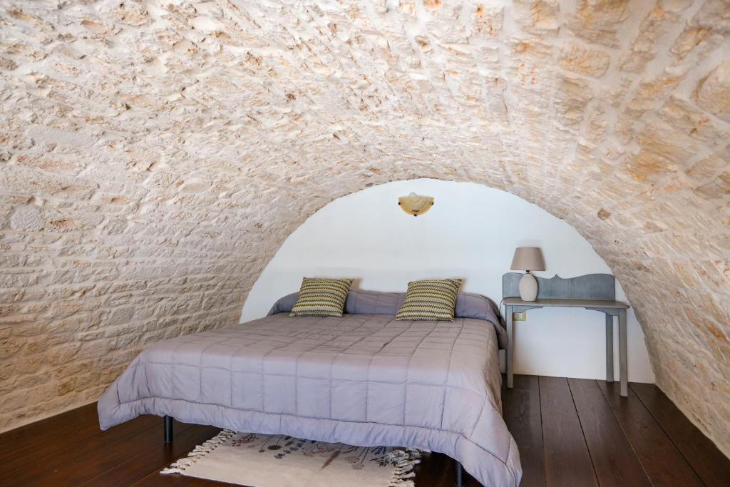 A bed or beds in a room at Dimora Monte Grappa