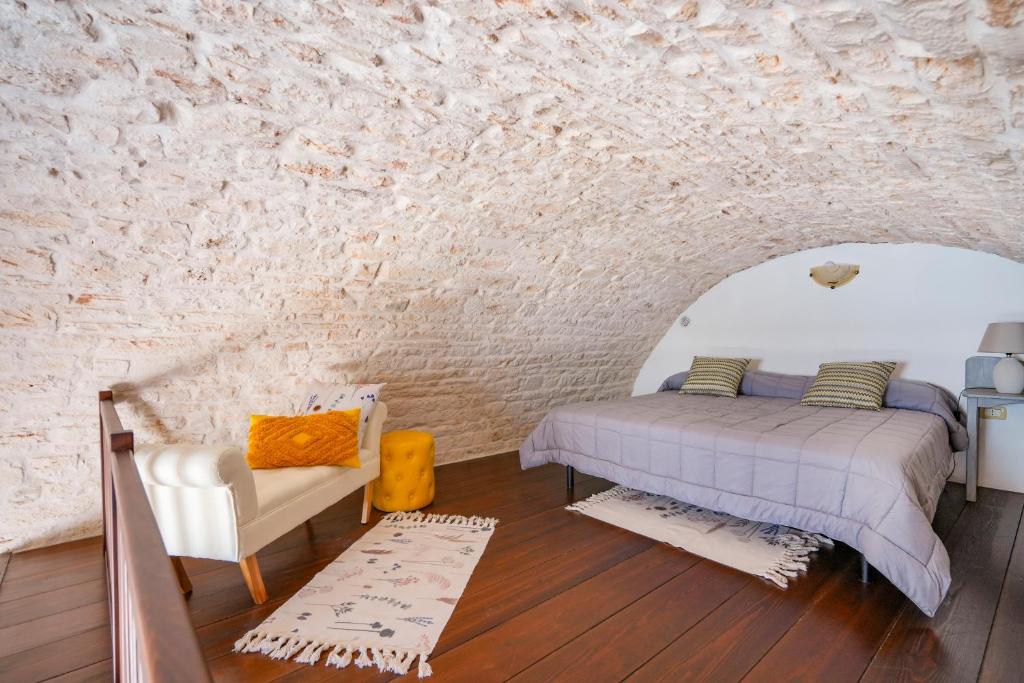 A bed or beds in a room at Dimora Monte Grappa