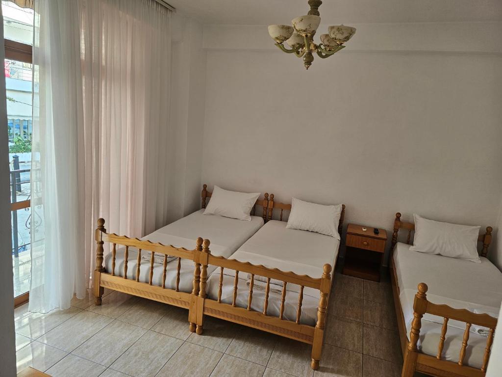Postel nebo postele na pokoji v ubytování Vasilika rooms