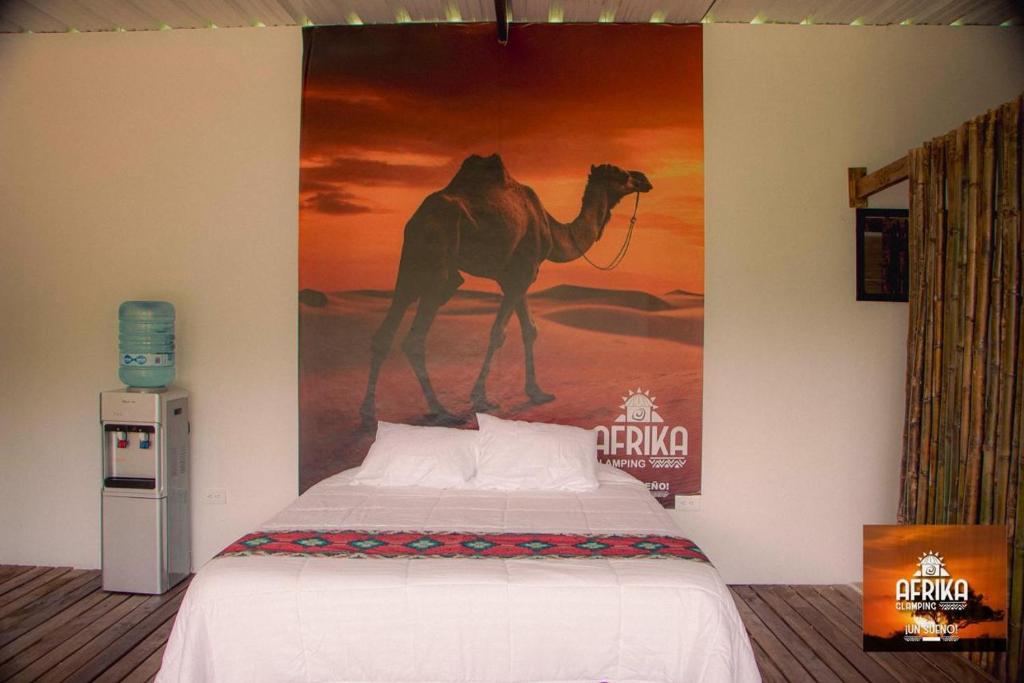 Postel nebo postele na pokoji v ubytování Afrika Glamping